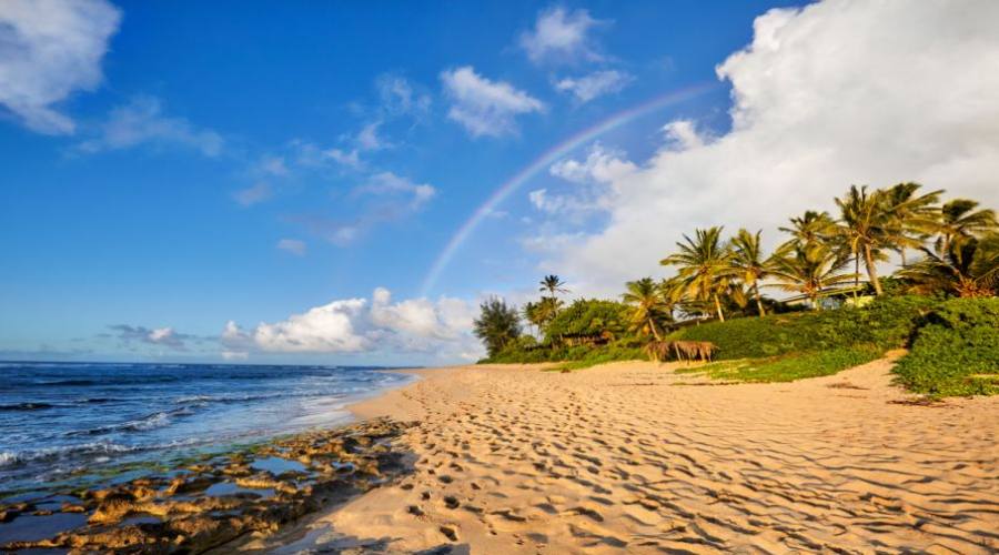 rainbow scenic view over the popular surfing place Sunset Beach, North Shore, Oahu