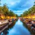 Scende la notte su canali di Amsterdam